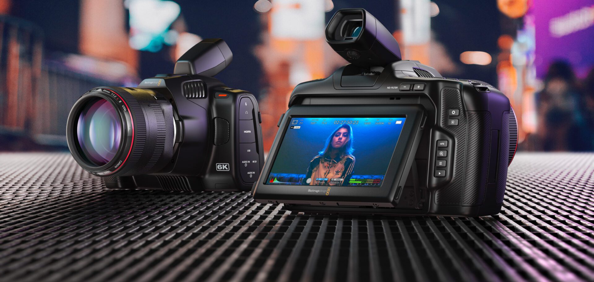 A camera with a picture of a woman on the screen.